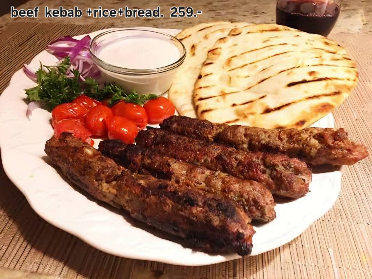 Mixed food platter with colorful ingredients and dipping sauces