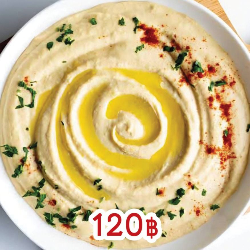 Creamy hummus platter with pita bread and fresh garnish