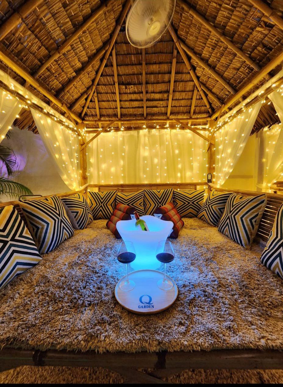 Private VIP tent with fairy lights, cushions, and cozy seating